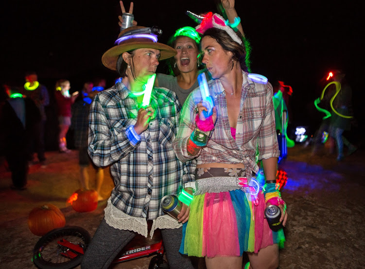 The ladies of Burning Bike are a rowdie bunch. Mia Phillips and Tricia Shadell pose in their Wild Wild West attire while Emily Sherman photo bombs // photo credit :: Eric Rasmussen